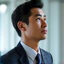 Portrait of David, a professional man in his late 40s, looking focused.