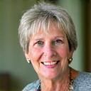 Portrait of Margaret, a smiling woman in her 50s, looking refreshed.