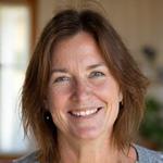 Headshot of Emily, 38, with a calm, vibrant expression, indicating improved well-being.